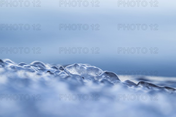 Close-up of ice-covered water in various shades of blue with a mystical aura, Korpoström, Korpo or