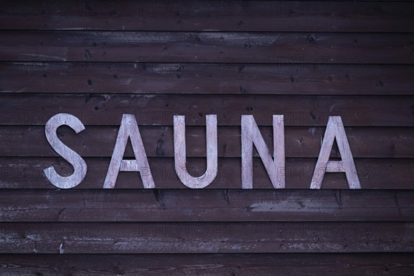 Rustic wooden wall sign with the inscription 'Sauna', Korpoström, Korpo or Korppo, Southwestern