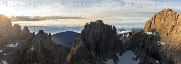 Impressive mountain peaks of the Brenta Mountains, sunrise, 360 degree alpine panorama, aerial