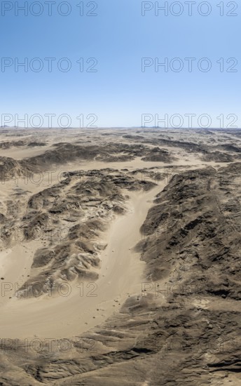Aerial view, dry barren mountains in Moon Valley, rocky landscape ridged by erosion, Namib-Naukluft