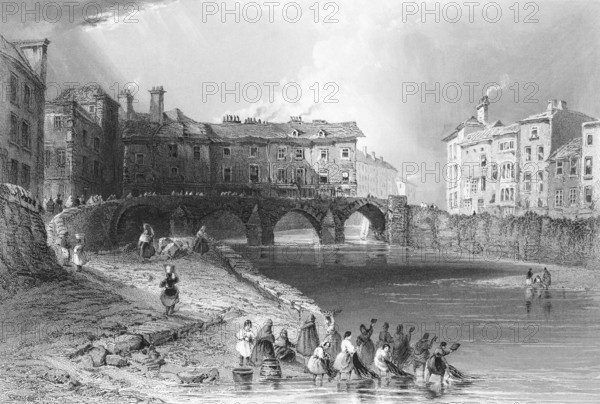 Bridge over the Shannon River in Limerick, woman fishing, Province of Munster, Ireland, city scene,