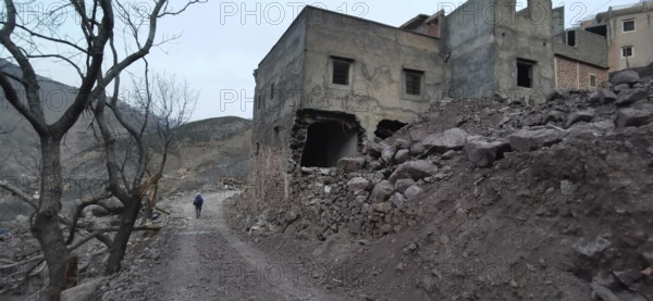 Dilapidated, collapsed buildings following an earthquake in the Atlas Mountains, on a lonely,