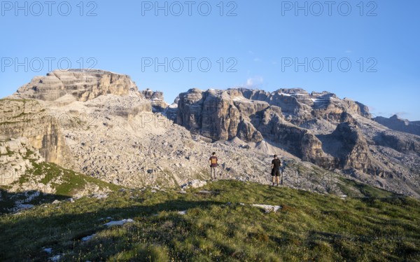 Hikers on the Grosté Plateau, mountain peaks of the Brenta Mountains, Brenta, Brenta-Adamello