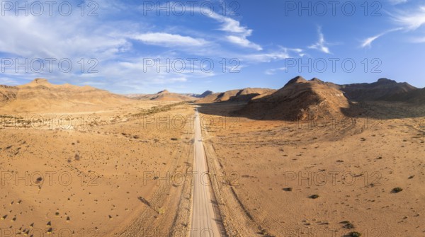 Aerial view, Eternally long straight road, road C14 through the Naukluft Mountains, desert and dry