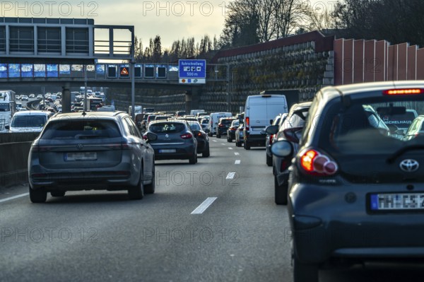 Driving on the A40 motorway, Ruhrschnellweg, in heavy traffic, drivers' perspective, Bochum, North