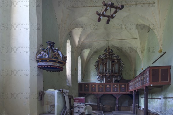 Interior with baroque organ of the abandoned 16th century Protestant fortified church, Tobsdorf,