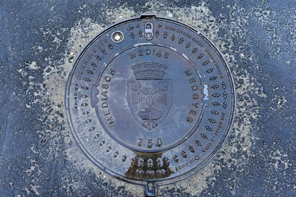Manhole cover with city coat of arms of Medias, Romania