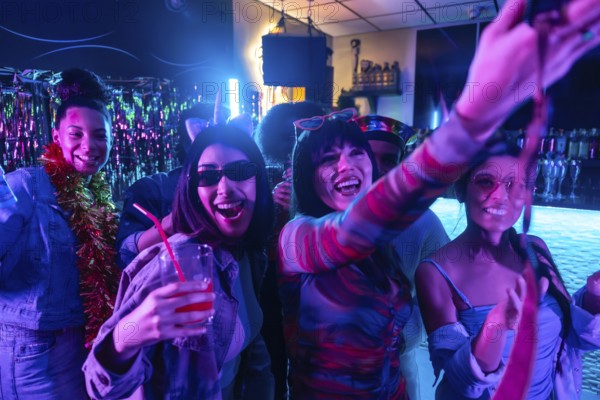 Young diverse friends enjoying a lively nightclub party, smiling, dancing, and posing for a selfie,
