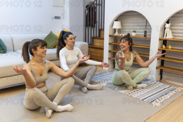 Three young women sitting in a modern living room discovering happiness through friendship and