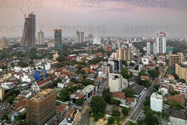 Urban scene at dusk with high-rise buildings and quiet surroundings, The skyline of Colombo in Sri