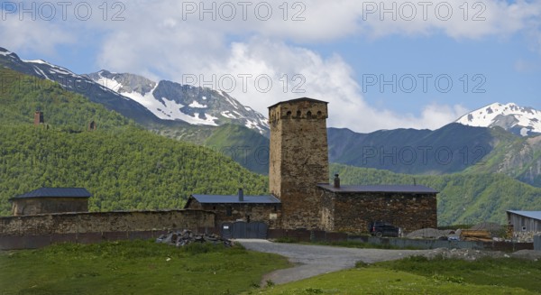 Wehrturm in the mountains against cloudy sky, Lamaria Church, Ushguli, Ushguli, Upper Svaneti,