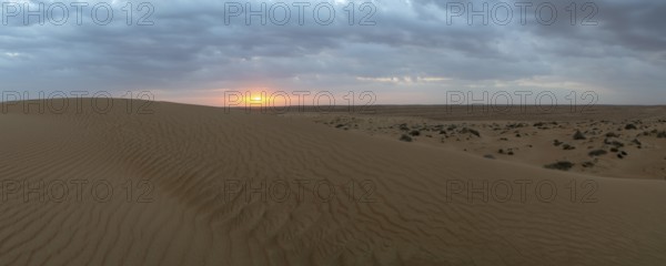 Sunset, sand dunes in the Wahiba Sands desert, Oman