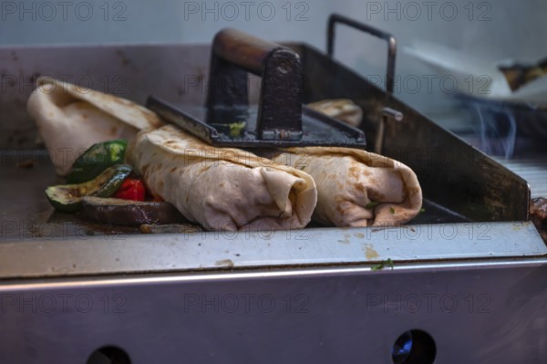 Finished falafel on a hot plate, in a falafel stand in the pedestrian zone, Nuremberg, Middle