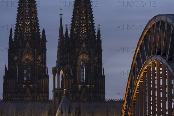 Evening atmosphere, Cologne Cathedral illuminated with LED lamps and the Hohenzollern Bridge,
