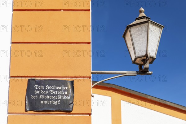 Lantern and façade with sign, Floods are prohibited from entering the monastery grounds, St.