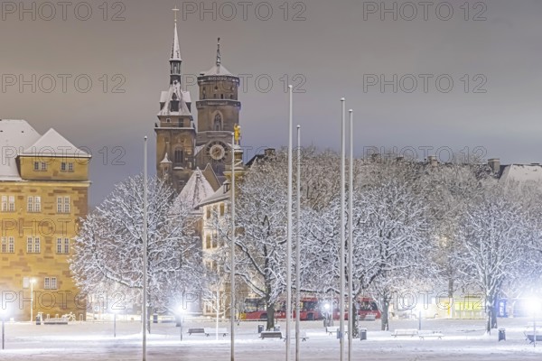 Winter in Stuttgart. The city is wintry white early in the morning. Castle square with collegiate