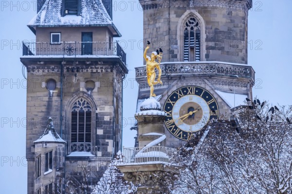 Winter in Stuttgart. The city is wintry white early in the morning. Collegiate church with
