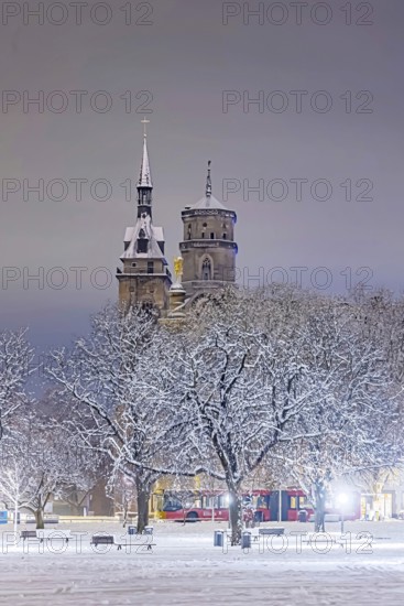Winter in Stuttgart. The city is wintry white early in the morning. Castle square with collegiate