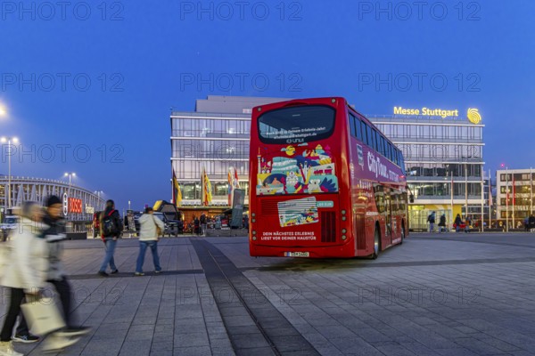 Stuttgart City Tour. Red double-decker for sightseeing tours at Messe Stuttgart. Stuttgart,