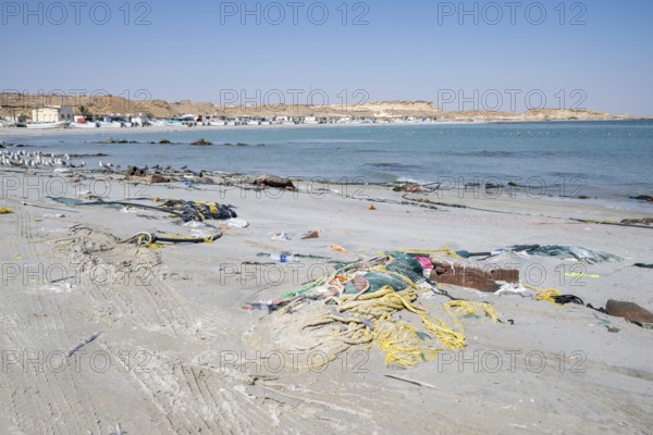 Garbage, fishing nets and plastic on the beach, Oman