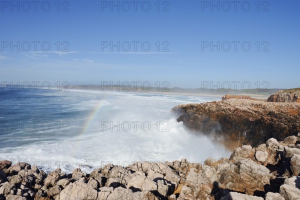 Surf with rainbow on the rocky coast, Carrapateira, Parque Natural do Sudoeste Alentejano e Costa