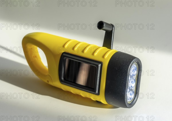 Crank operated flashlight, by turning the crank, we generate electricity in a dynamo, which charges