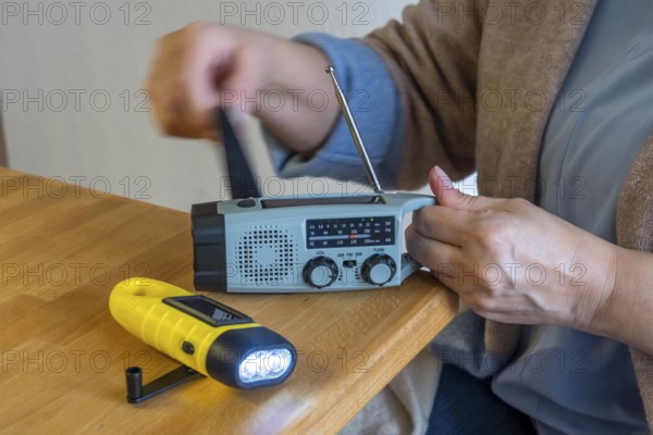 Emergency equipment, flashlight and radio with crank operation, by turning the crank we generate