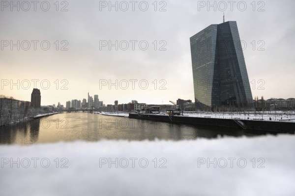Snow lies along the banks of the Main from the European Central Bank (ECB) to the Frankfurt banking
