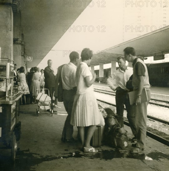 Historical photo summer 1961, tourists in front of returning home at Rimini train station, Rimini,