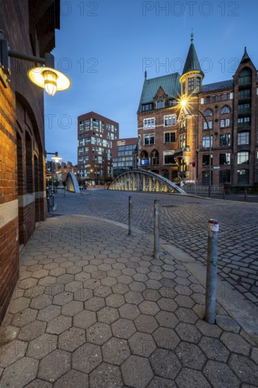 Walkway with lantern in Speicherstadt at the blue hour, Hamburg, Germany