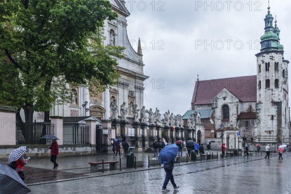 Sculptures of saints in front of St. Peter and Paul Church, St. Andrew's Church on the right,