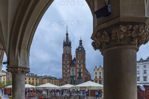 View of St. Mary's Basilica from the arcades of the Cloth Hall, Market Square, Krakow, Poland