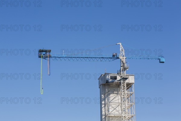 Montreal Bungee Tower with dangling long yellow elastic bungee jumping cord, Old Port of Montreal,