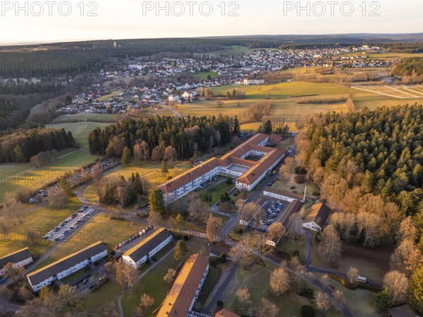 Buildings and fields surrounded by forest at dusk of a rural scene, rehab clinic, Schömberg, Black