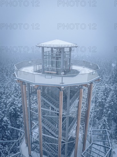 A snow-covered treetop trail with views of the snow-covered landscape, Himmelsglück observation