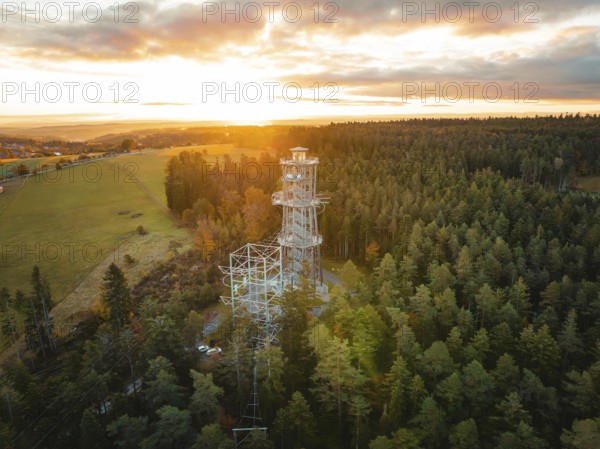 Tower immersed in the warm light of the dawning day, Himmelsglück observation tower with Flying