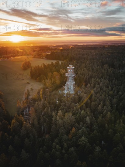 Landscape view with observation tower in foreground and sunset, Himmelsglück observation tower with