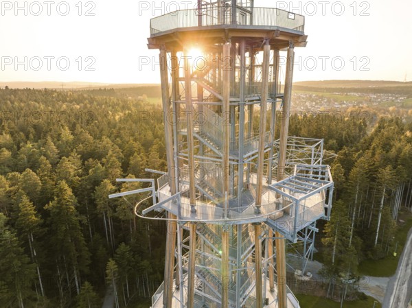Spire at setting sun surrounded by thick forests, Himmelsglück observation tower with Flying Fox,