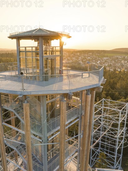 Observation tower with a view of a city in the background at sunset, Himmelsglück observation tower