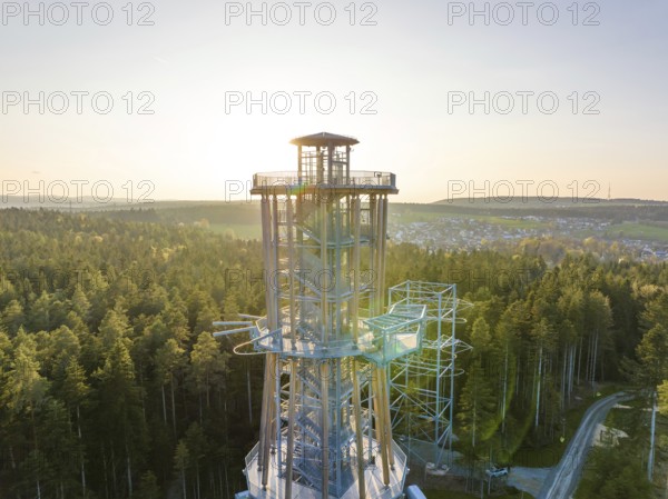 High observation tower in a wooded area at sunset with a view over the valley, Himmelsglück