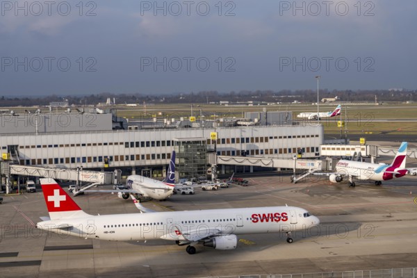 Düsseldorf airport, DUS, terminal A Eurowings aircraft at the gate, Swiss Airbus A321-200 aircraft