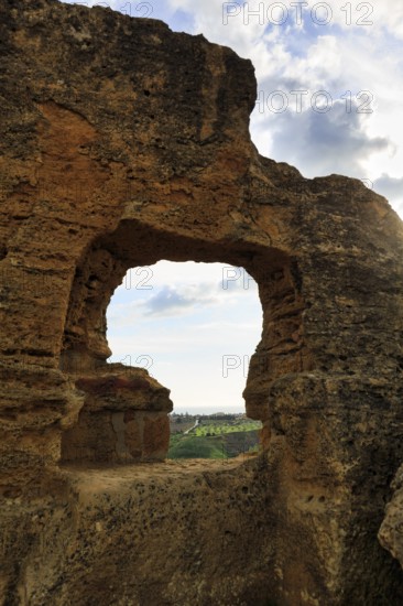 Arkosolium path, necropolis, view through arched niche on coastline and the sea, burial chamber,