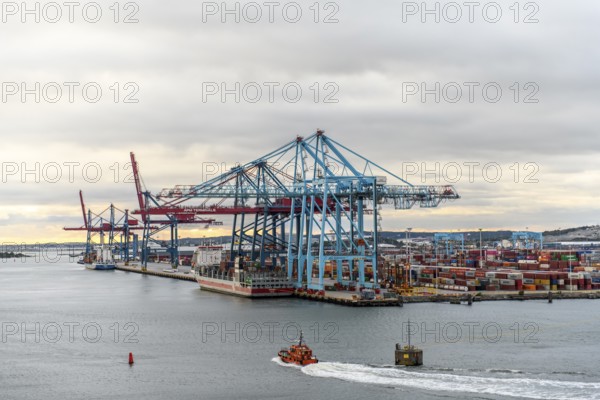 Container port with huge cranes and lots of colorful containers on the water, Stena Line