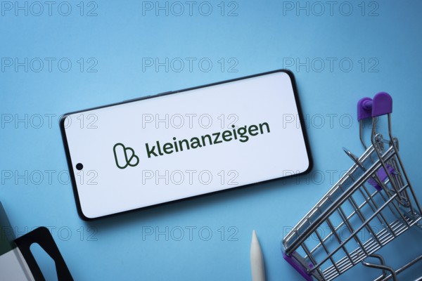 Dhaka, Bangladesh- 03 July 2025: Smartphone displaying Kleinanzeigen logo with shopping cart on a