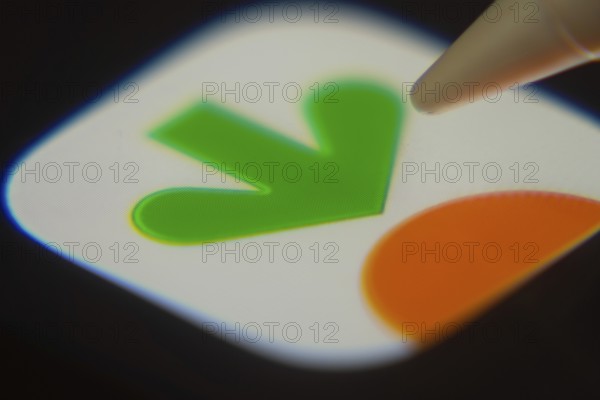 Dhaka, Bangladesh- 06 Dec 2025: Close-up of the Instacart app on a screen with a stylus pointing at