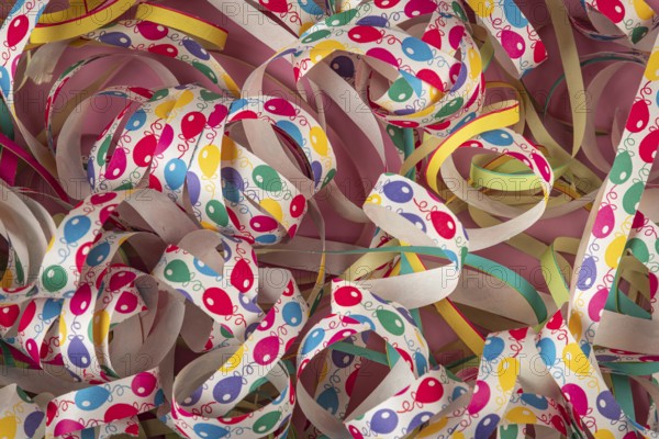 Colourful streamers with balloon patterns in different colors, carnival