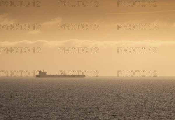 Silhouette, cargo ship, evening light, Baltic Sea