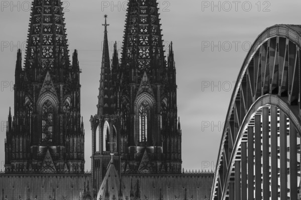 Evening atmosphere, Cologne Cathedral illuminated with LED lamps and the Hohenzollern Bridge,