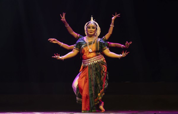 Artists perform Odissi classical dance during a cultural evening program at Shilpgram Mohotsav 2026