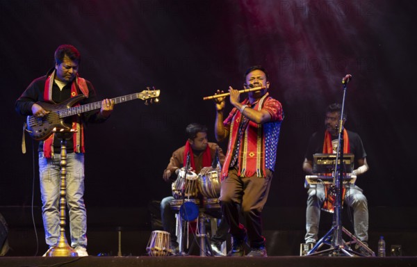 Flutist Dilip Hira performs during a cultural evening program at Shilpgram Mohotsav 2026 in